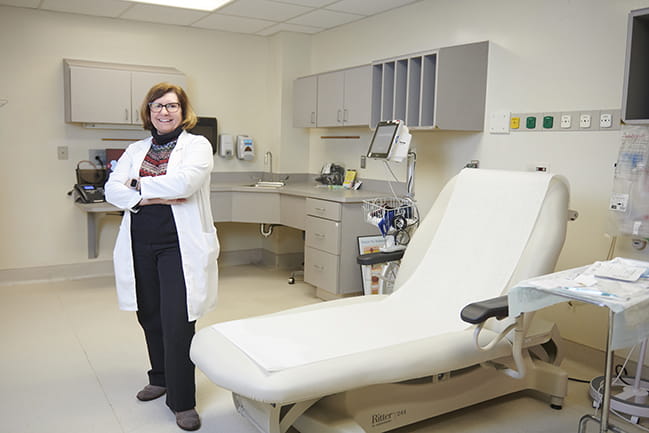 Nurse researcher Teresa Kelechi, Ph.D., posing in clinic 